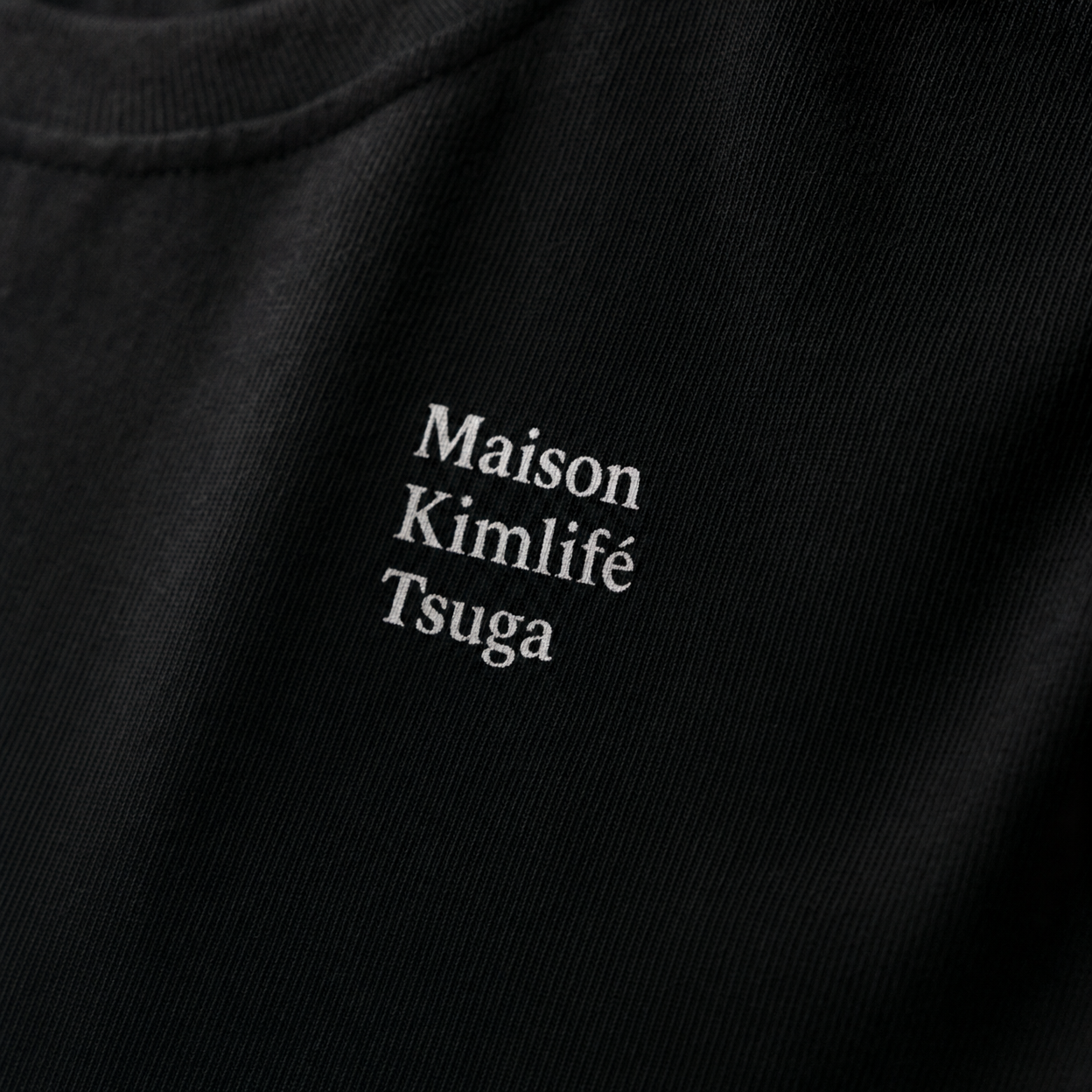 Black Tee — logo detail